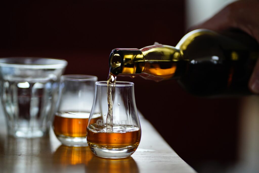 How many shots of Whiskey does it take to get tipsy?