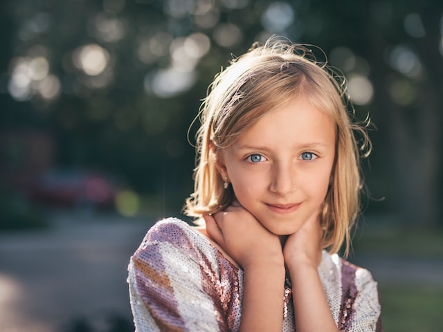 What nationality has blonde hair and blue eyes?