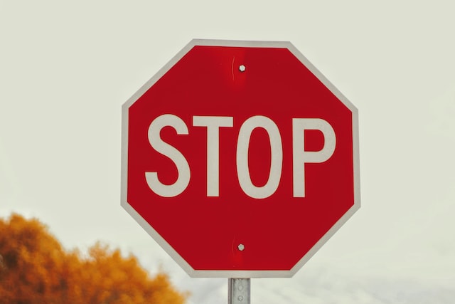 What shape is a British stop sign?