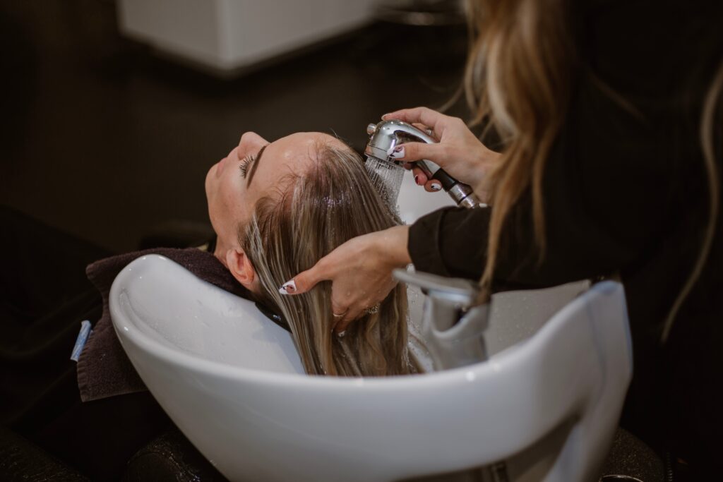 Why do salons wash your hair after coloring?