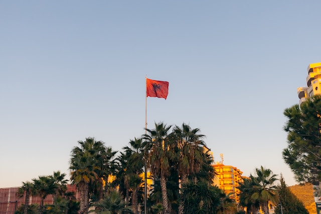 Who has a red and black flag?