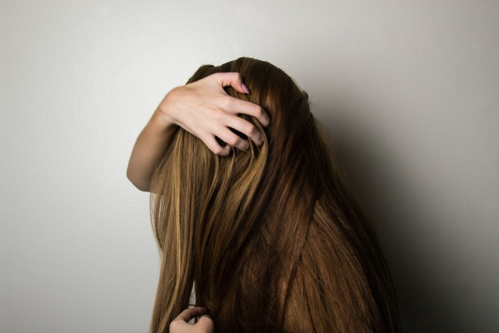 What race has thick hair ?