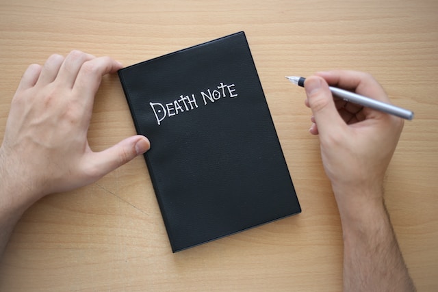 Why does l sit weird in death note?