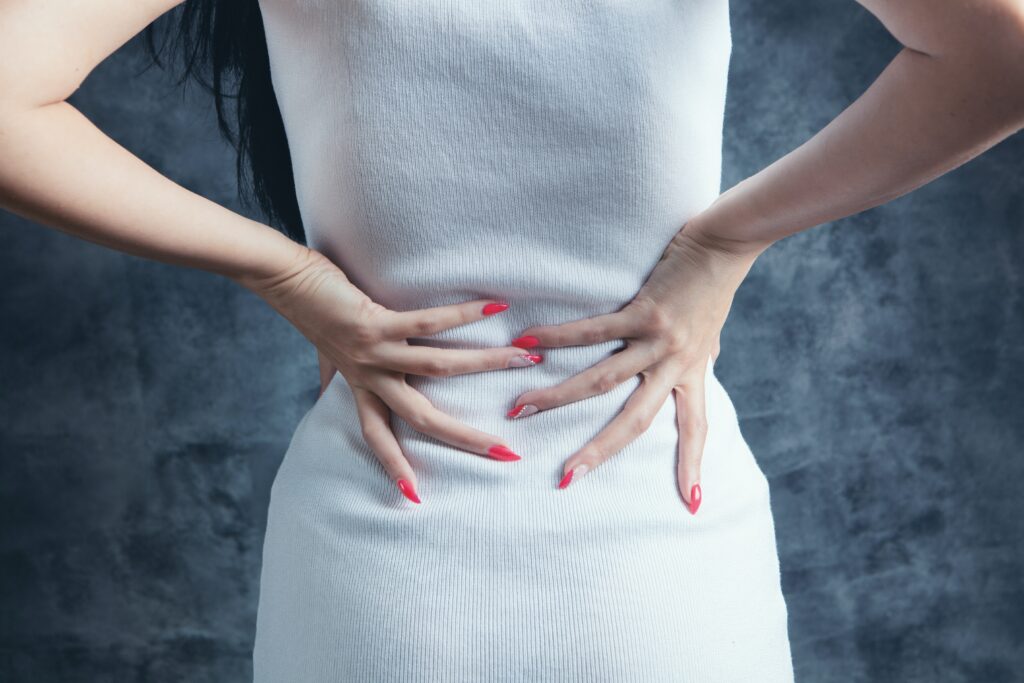 What causes a woman to have big hips?
