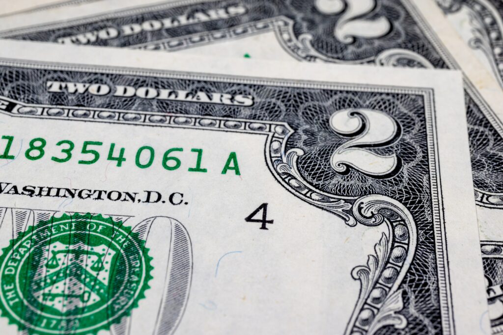 What is a 2 bill with red ink?