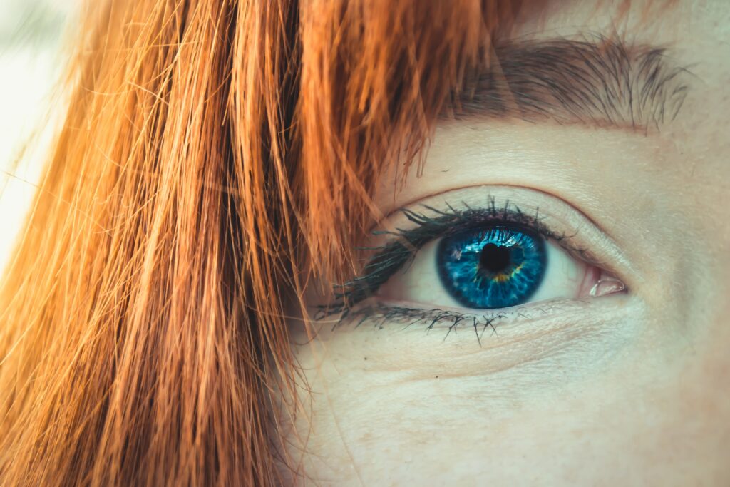 What percent of the world have red hair and blue eyes