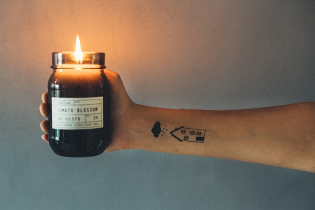 What is the meaning of a candle tattoo?