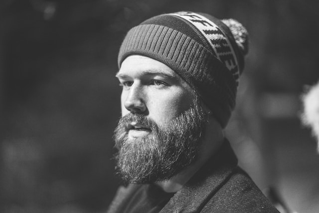 What race grows less facial hair?