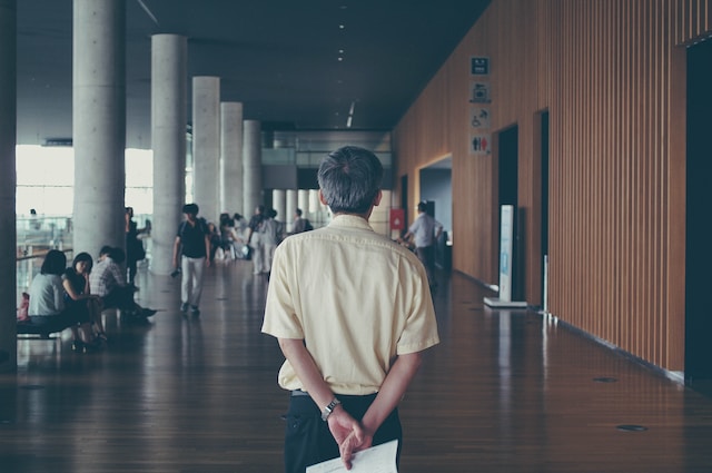 Why do guys put their hands behind their back?