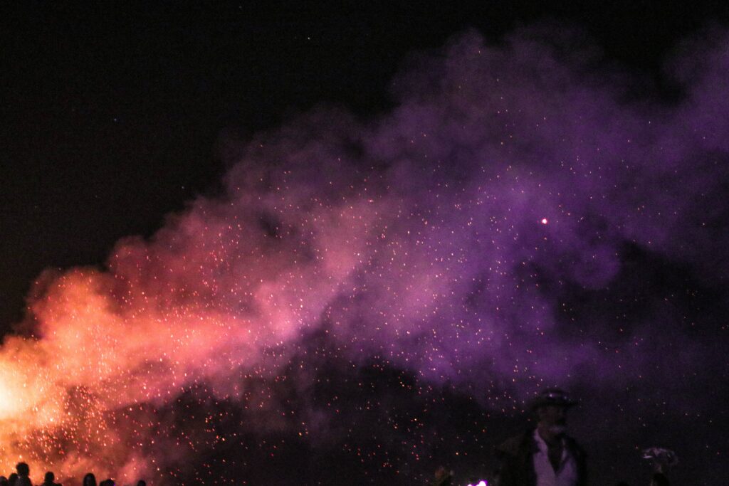 What causes purple flames in a fire
